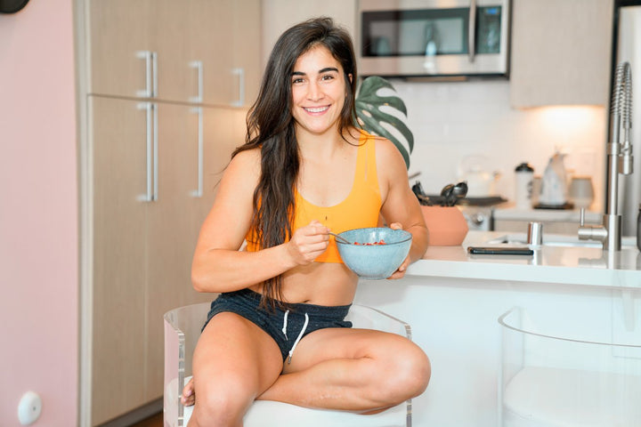 Lauren Fisher enjoying a healthy meal from a bowl